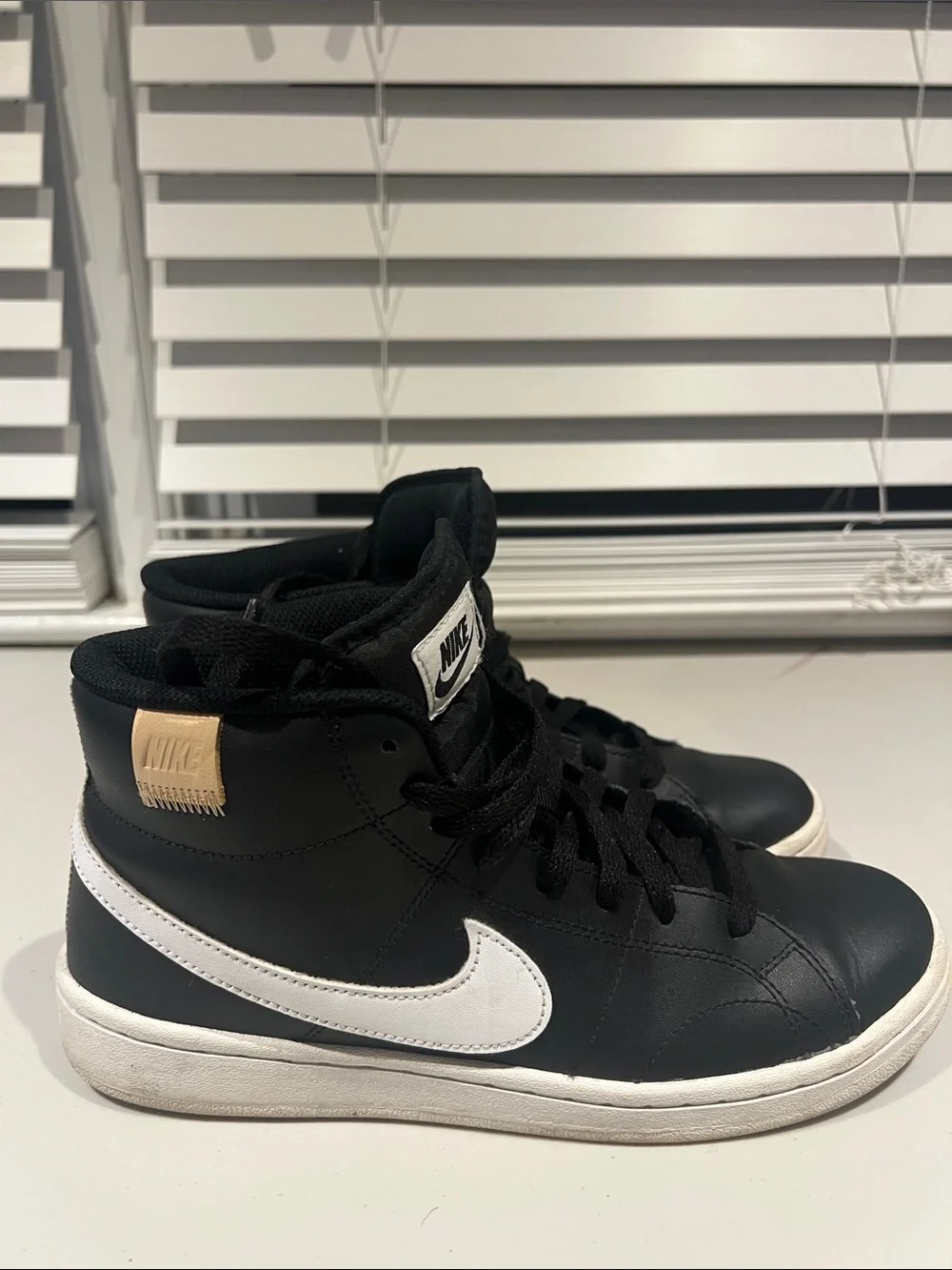 Nike Black High-Top Sneakers with White Soles and White Tongue Logo